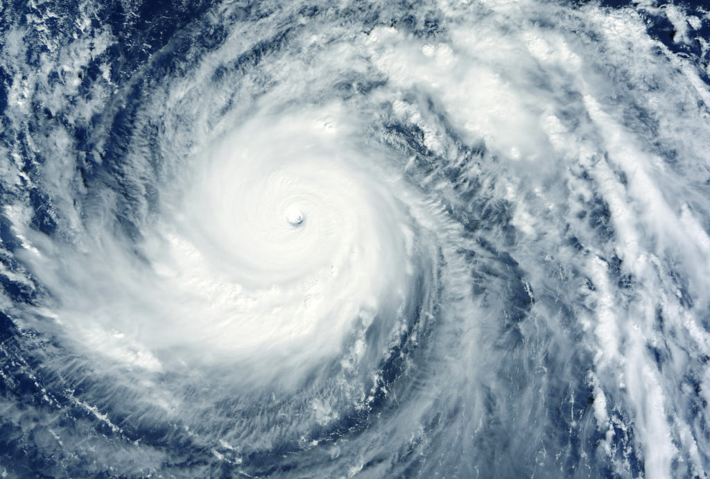 An aerial view of cyclone passing over the coast